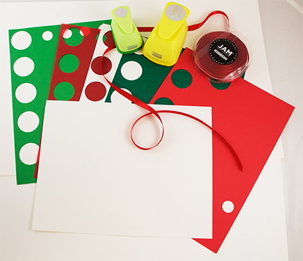 red paper, white paper, green paper with circles punched