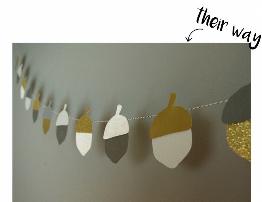"Their way," acorn garland over gray wall Acorn garland, "their way"