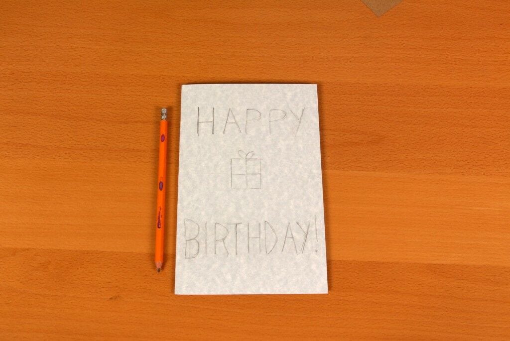 Pencil, card that says "Happy Birthday"