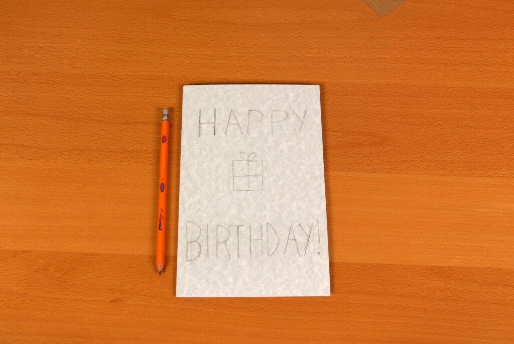 Card with "Happy Birthday!" pencilled on it Pencil, card that says "Happy Birthday"