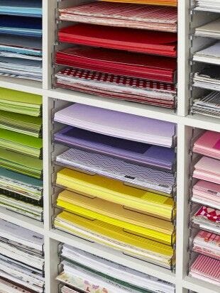 multicolored paper on shelves shelves, multicolored paper