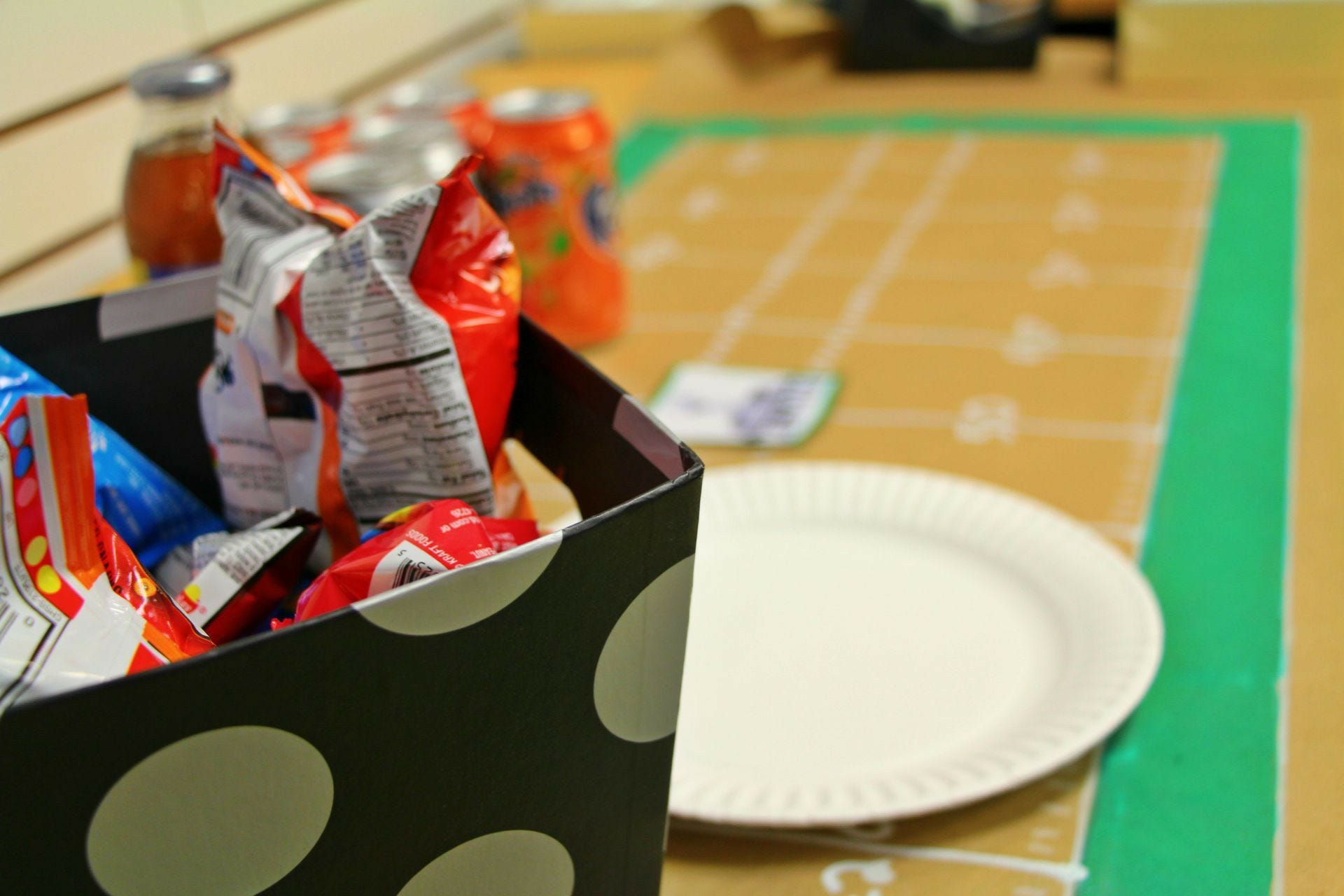 football field tablecloth, snacks, plates snacks on football field tablecloth