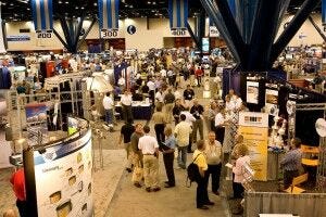 trade show filled with people and displays