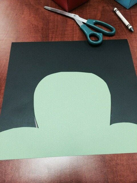 St. Patty's Day Kid's Craft green and black paper cut into hat shape