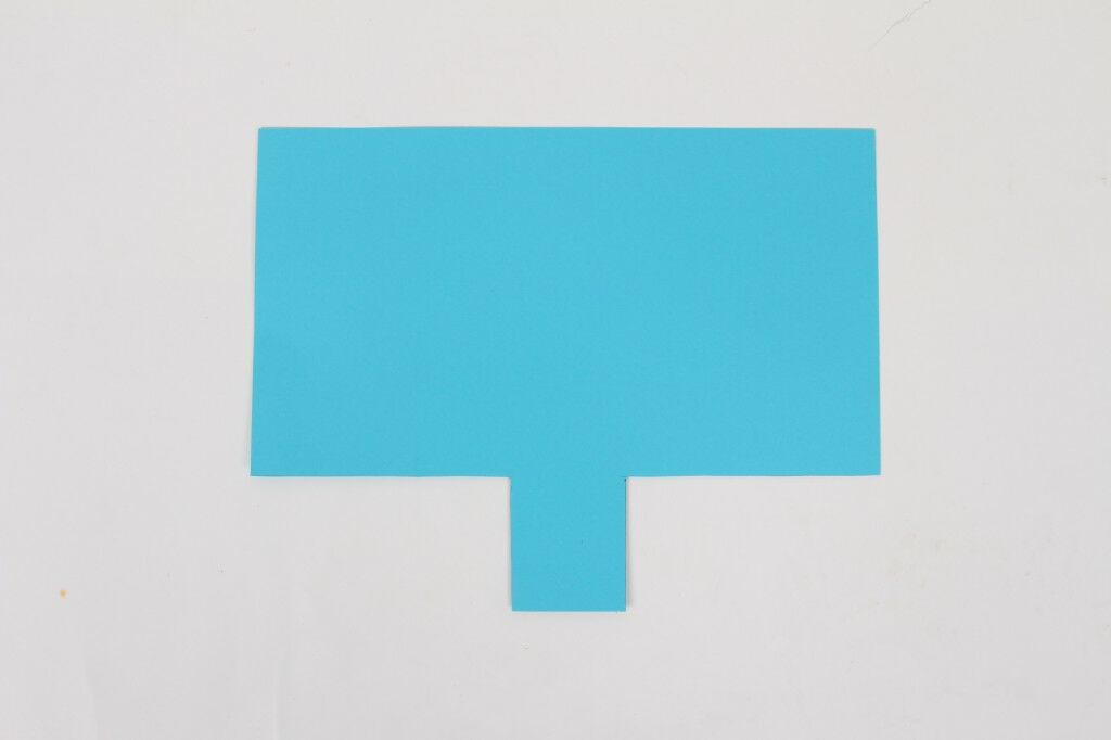 bright blue cardstock with two rectangles cut out from each side