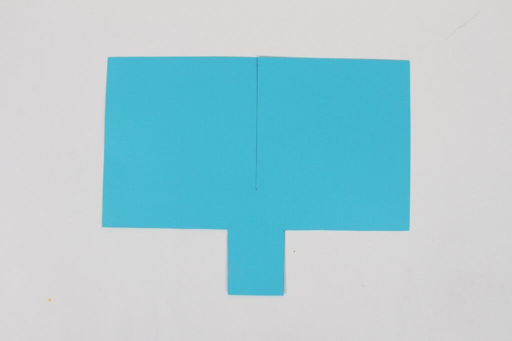 bright blue Paper Helicopter with rectangle cutouts and cut down center