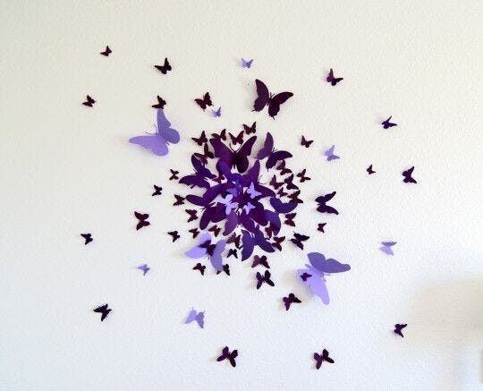 light purple and dark purple butterflies design on white wall