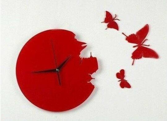 red clock and butterfly art on white wall wall art
