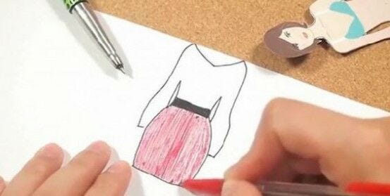 color in paper clothes with red pen on white paper