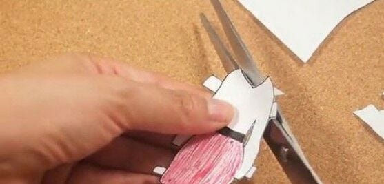 cut out doll clothes hands cutting out outfit with scissors