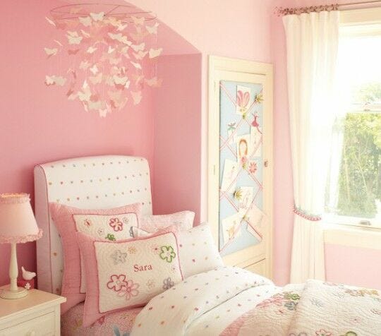 white and pink butterflies canopy over pink themed bedroom