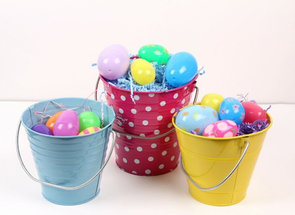 Easter eggs in colorful buckets