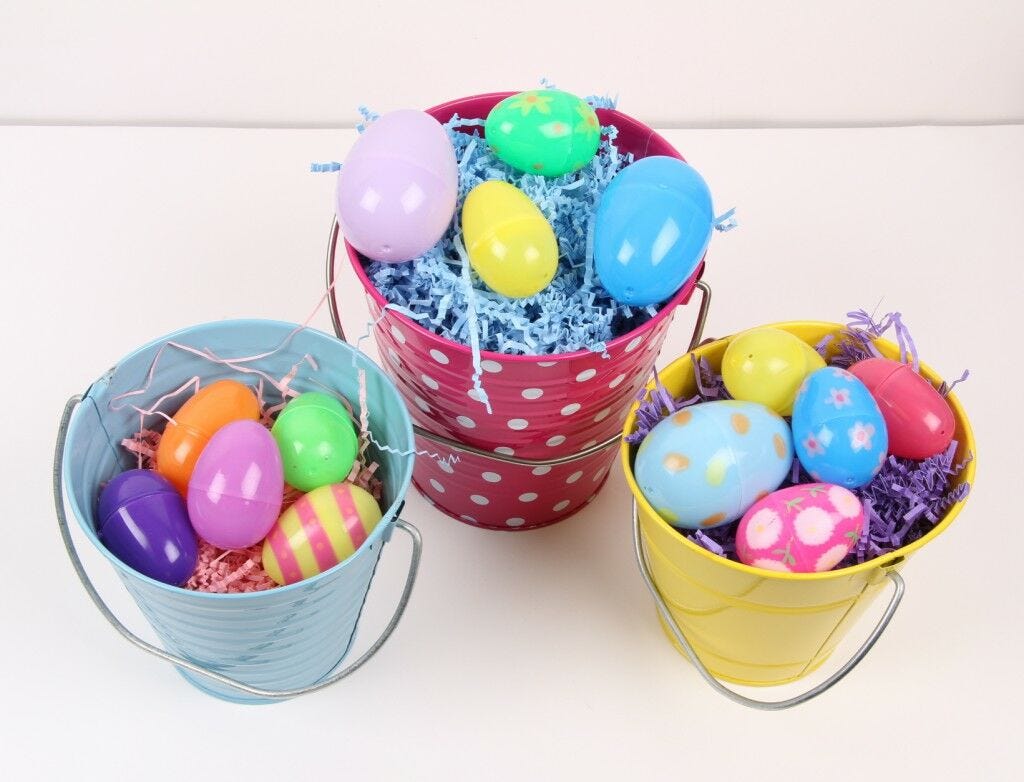 Easter eggs in colorful buckets