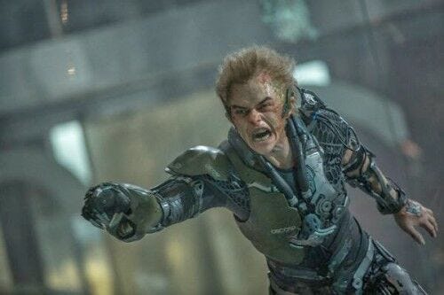 angry dane dehaan as green goblin wearing green suit and pointing