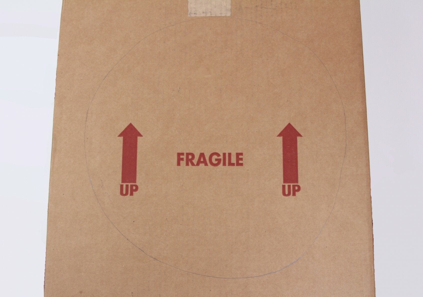 cardboard box with circle drawn on