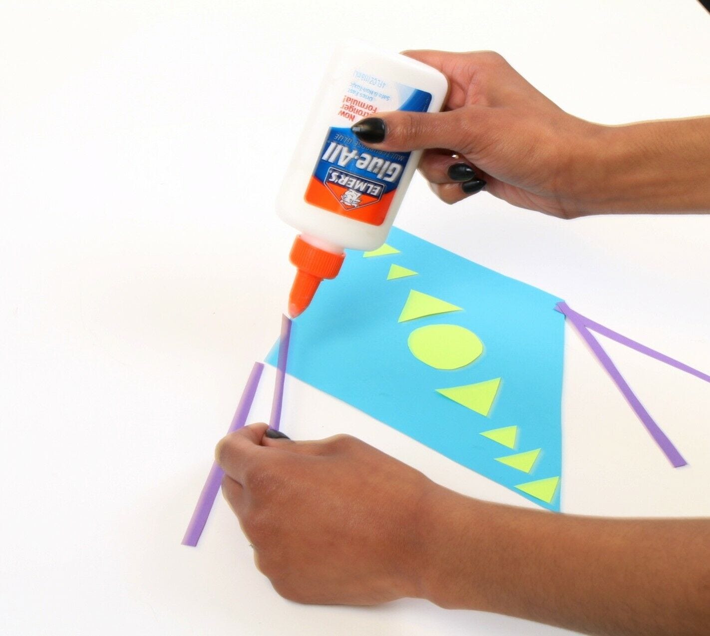 Gluing strips to kite - decoration