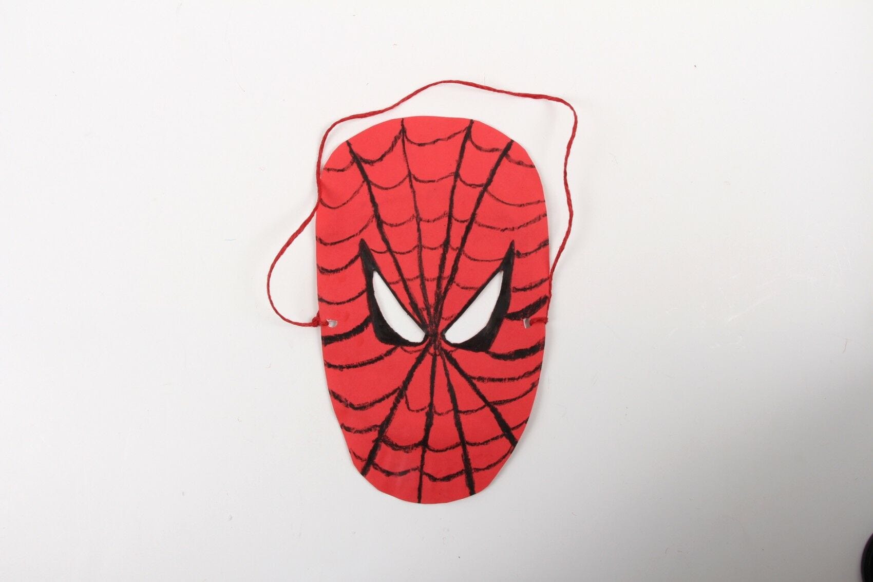 completed diy spiderman mask with black web lines drawn