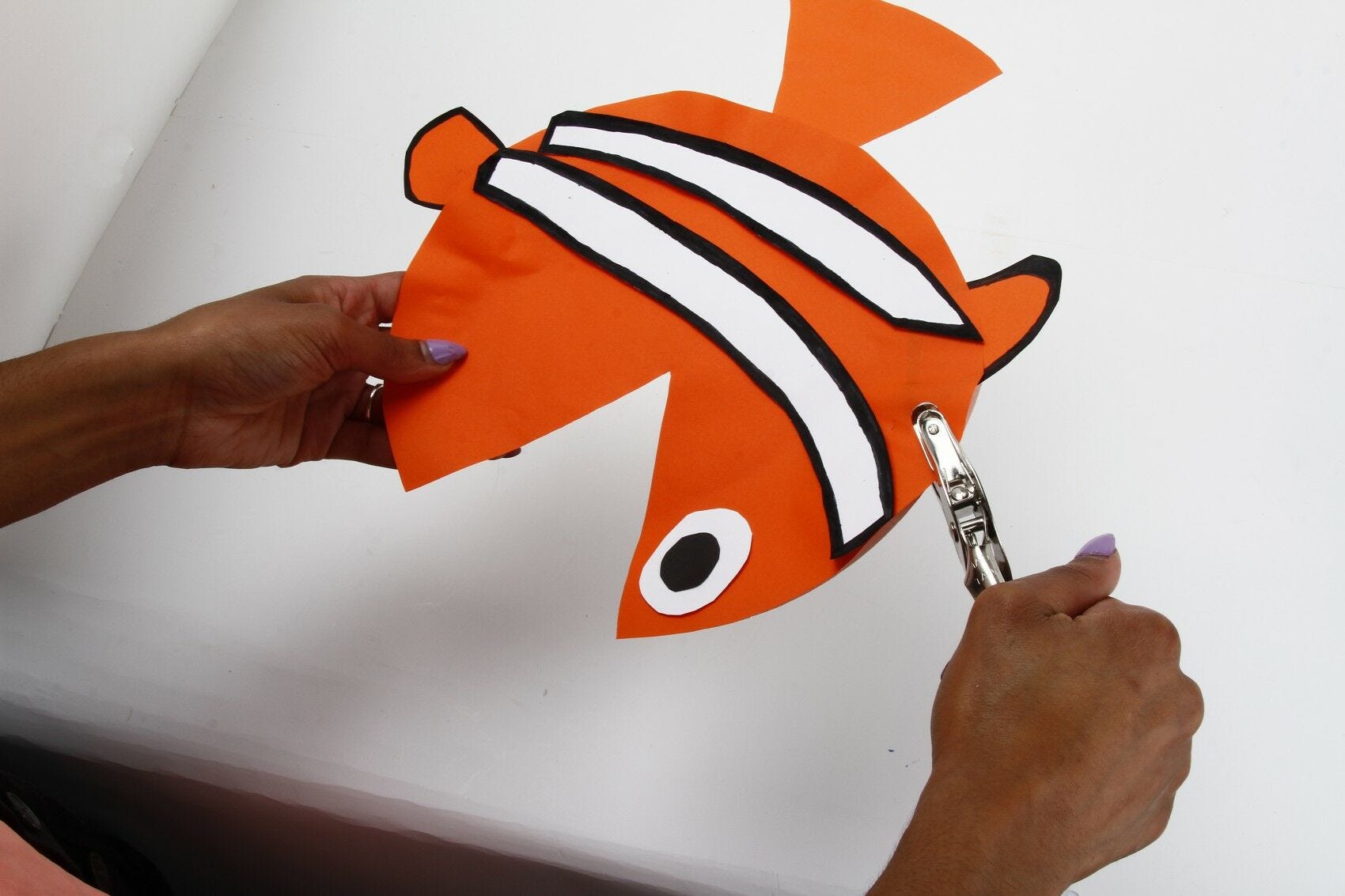 punching hole in fish punching hole in paper fish