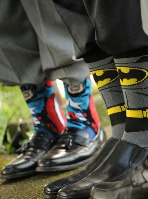 tux pants and dress shoes with super hero long socks pulled up