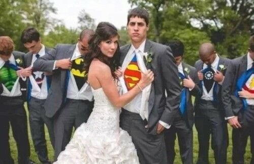bride opening grooms tux superman shirt and groomsmen opening tuxes superhero shirts