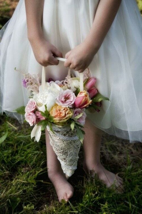 Flower girl holding flower cone