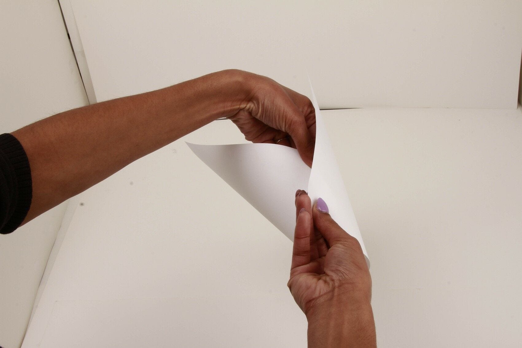 folding white paper into cone