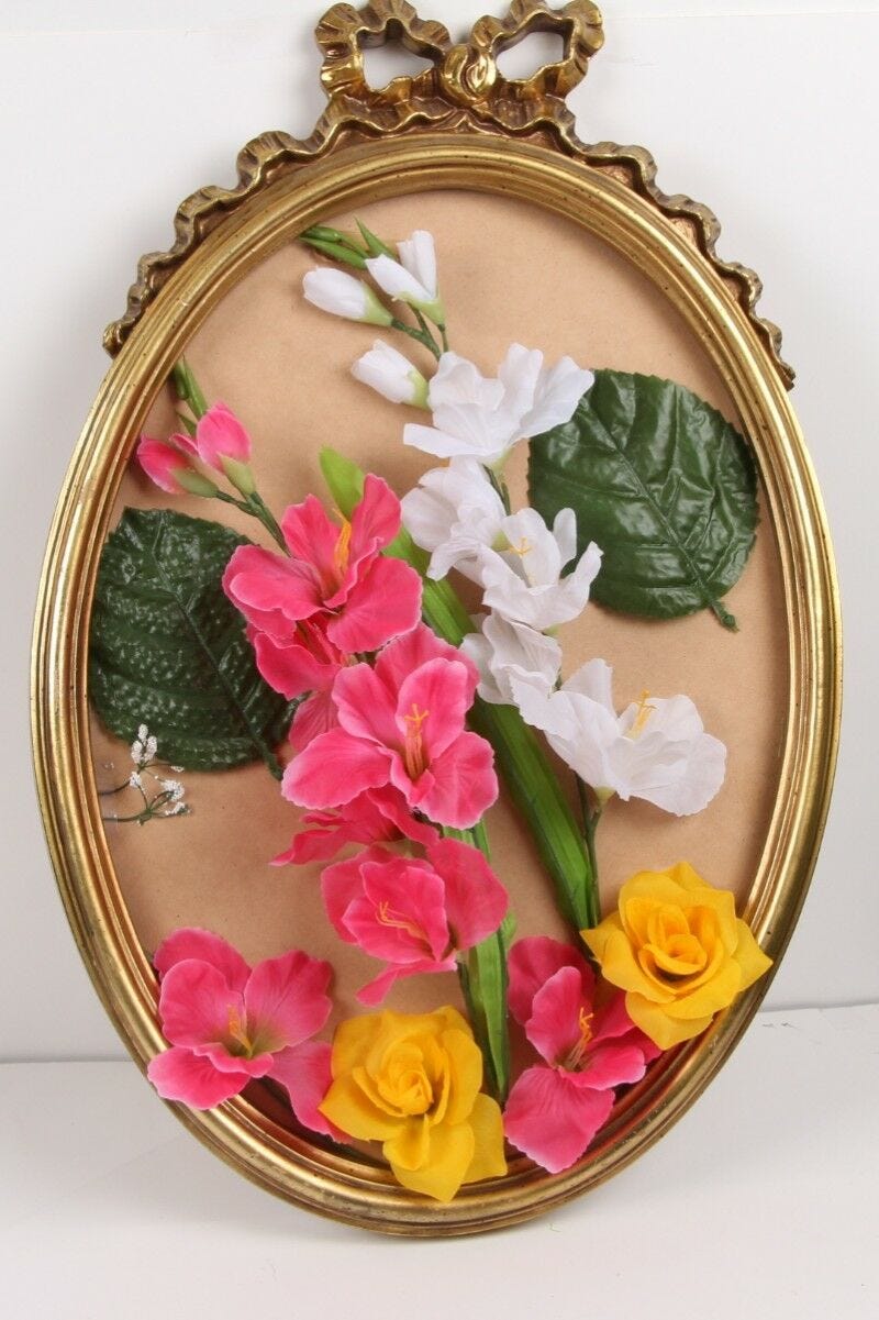 Completed DIY Bridal Shower Broken Mirror Craft with colorful silk flowers