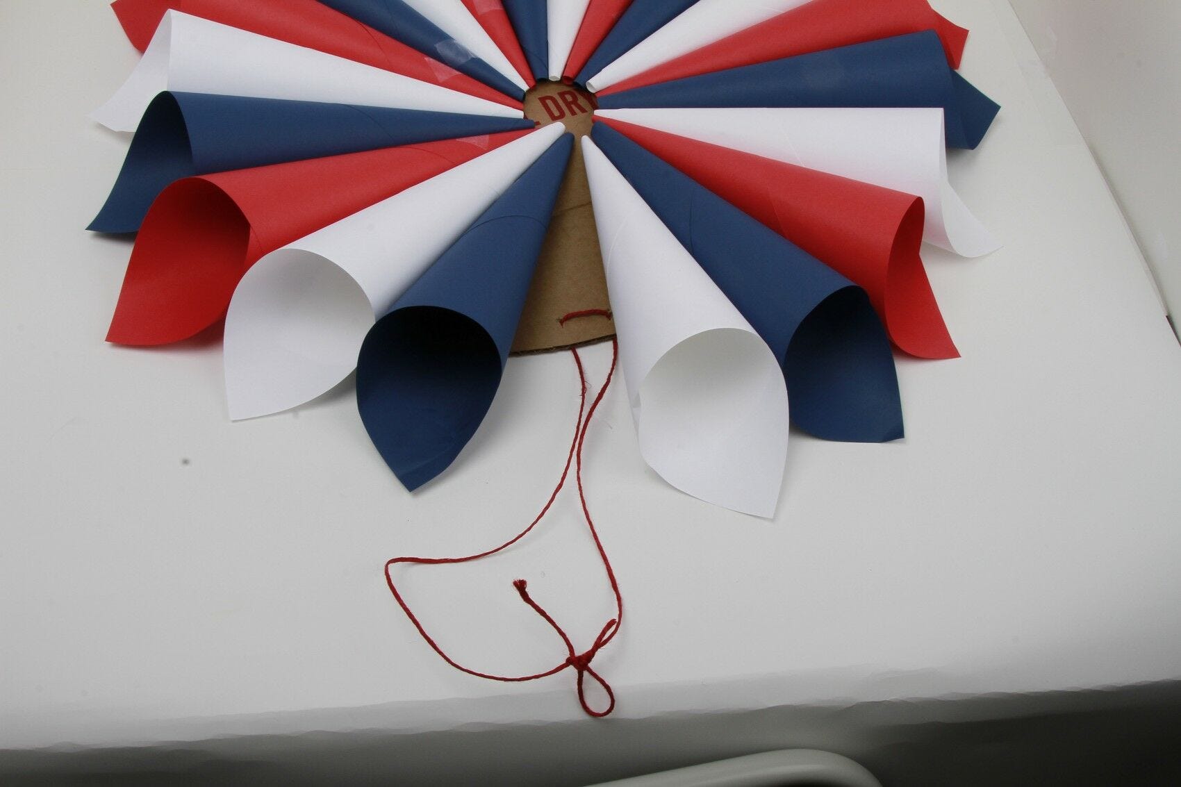 twine attached to cardboard circle