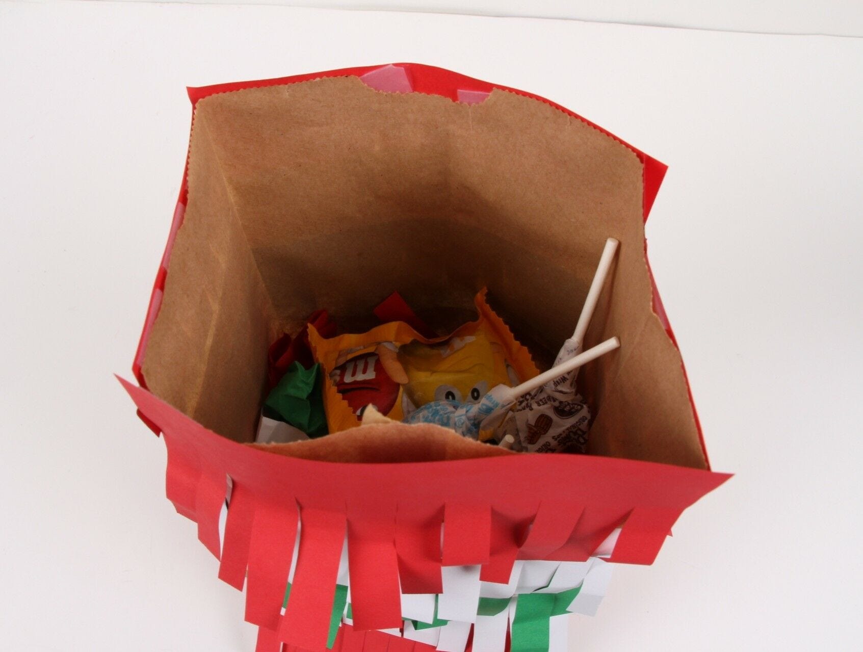 brown paper bag filled with candy