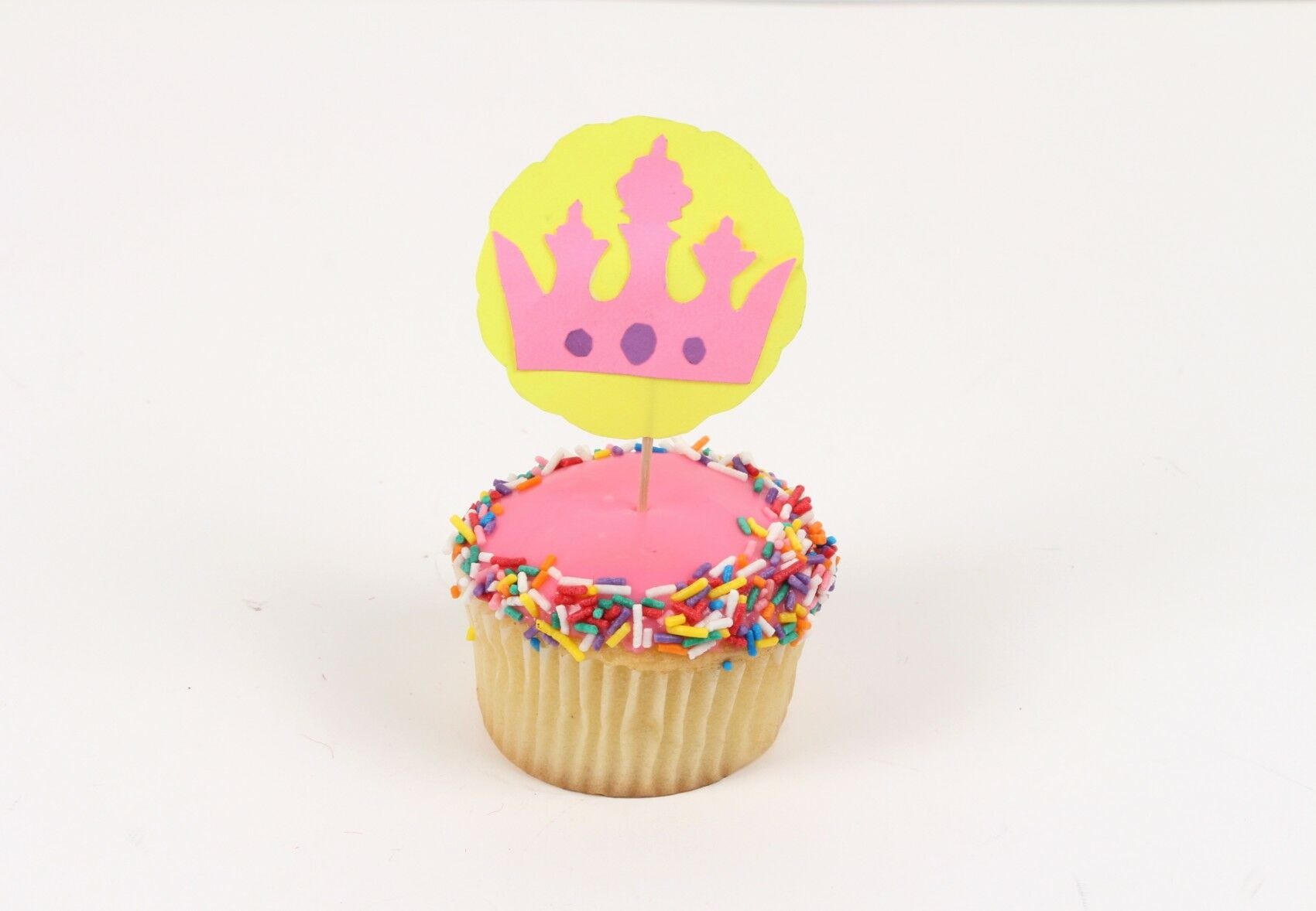 Crown topper stuck into cupcake