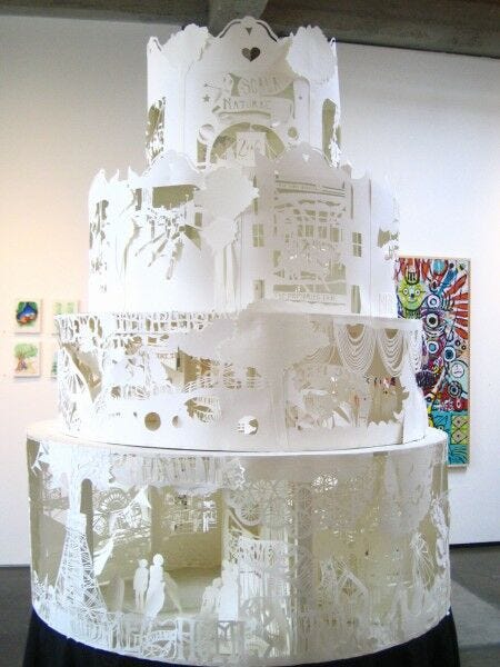 giant 3D white cake with different intricate layers and backgrounds