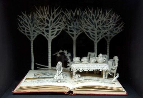 open book with paper trees, little girl, dining table set