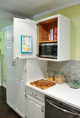 open white kitchen cupboard with grocery list on clipboard