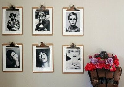 diy picture frames with black and white portrait photos on wall