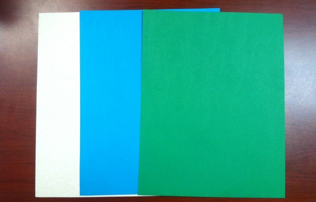 white, blue, green paper