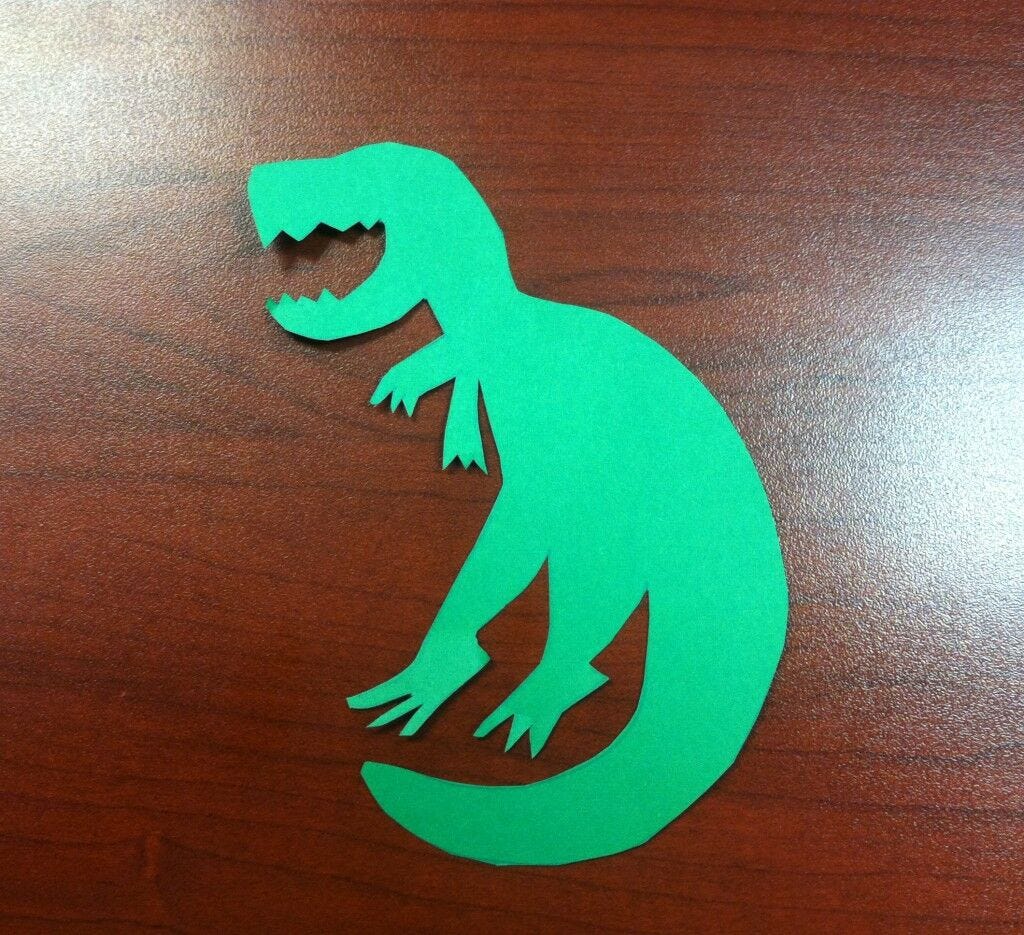 paper cut into t. rex