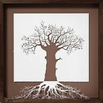 brown and white inverted tree with roots framed papercut design