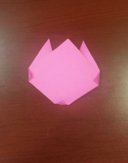 Pink paper folded flower shape