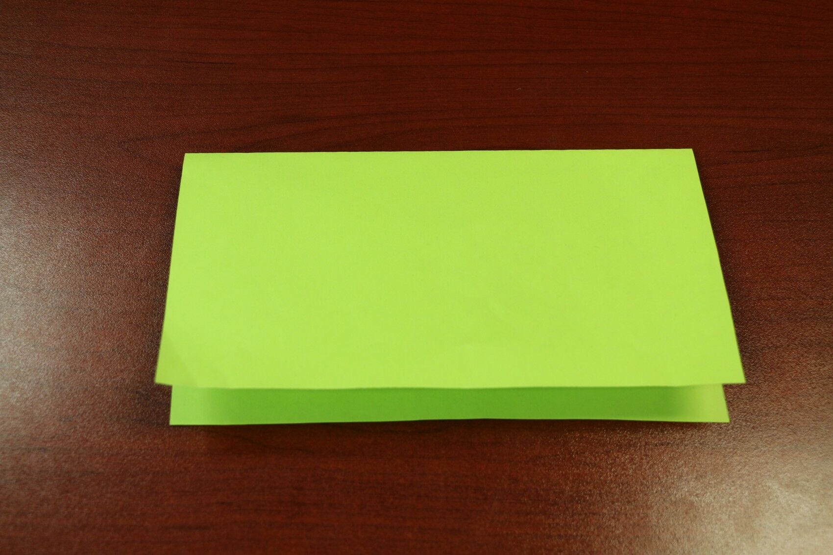 green paper folded in half