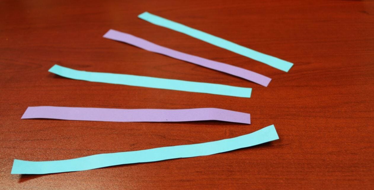 purple and light blue paper strips