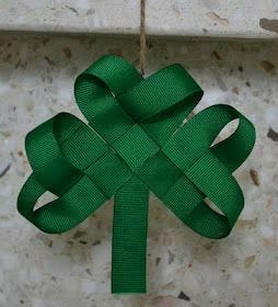 green grosgrain ribbon twisted in shamrock design hanging on brown twine