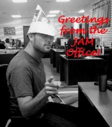 JAM employee with newspaper hat