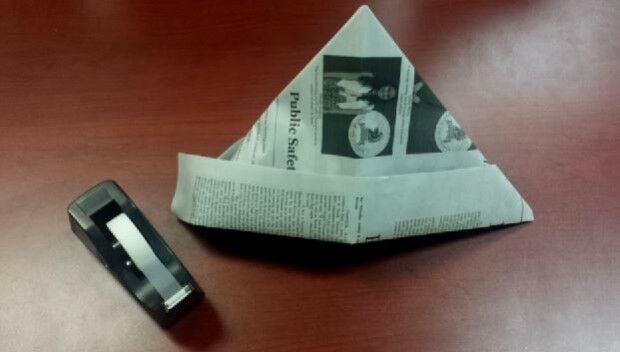 Newspaper open and flaps taped