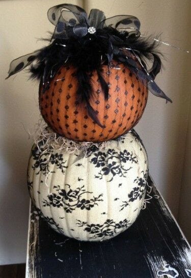 pumpkin carving alternatives: black lace covered orange and white pumpkins