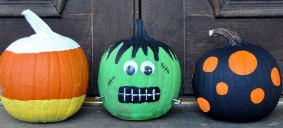 candycorn painted pumpkin, green frankenstein painted pumkin, and spotted pumkin