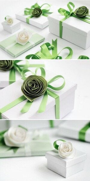 White gift boxes with paper flowers and ribbon