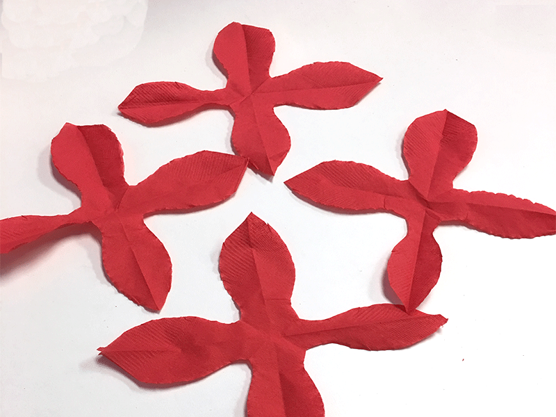 4 shapes of diy paper cocktail napkin poinsettias with open petals