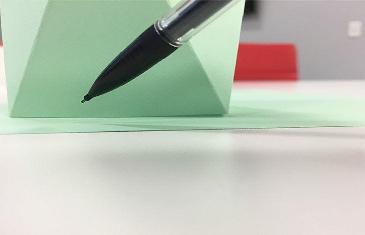 mechanical pencil with lead with green paper vase 