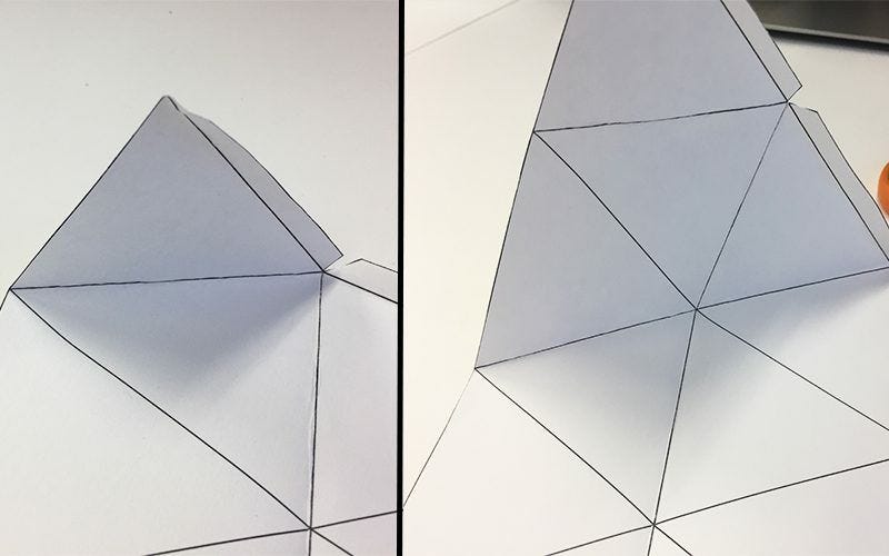 white paper with geometric shapes folded