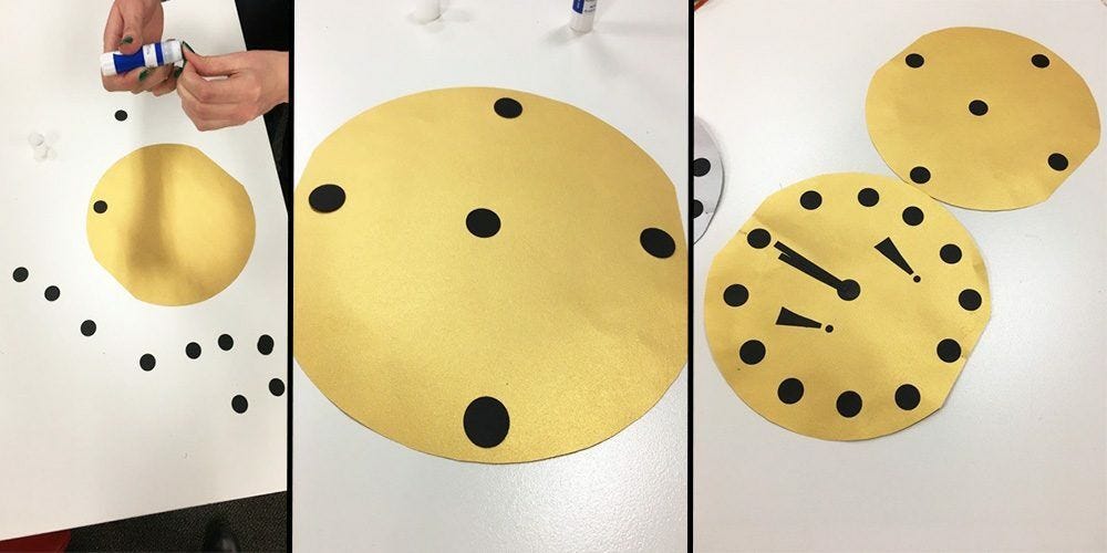 Black circles glued to large yellow cutout